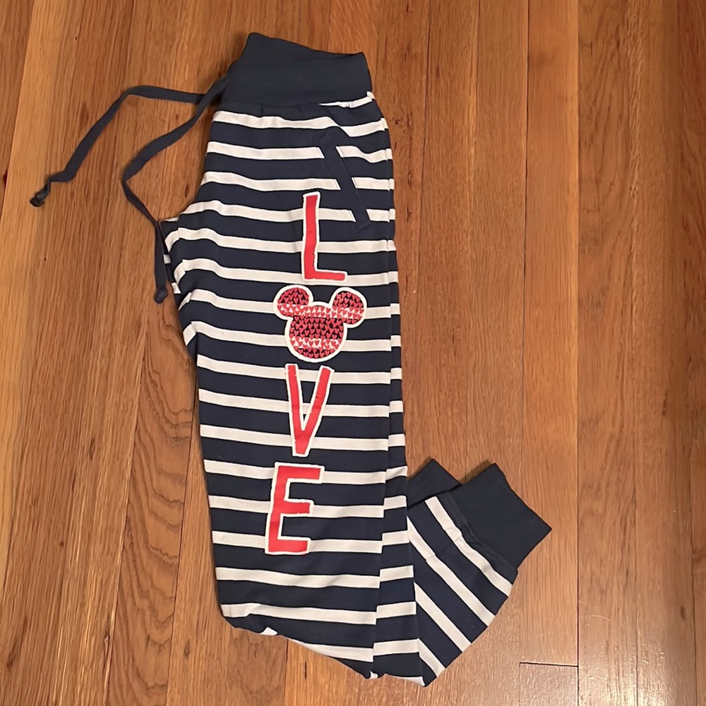 Striped Disney Parks joggers with “LOVE” logo on left leg.  EUC.